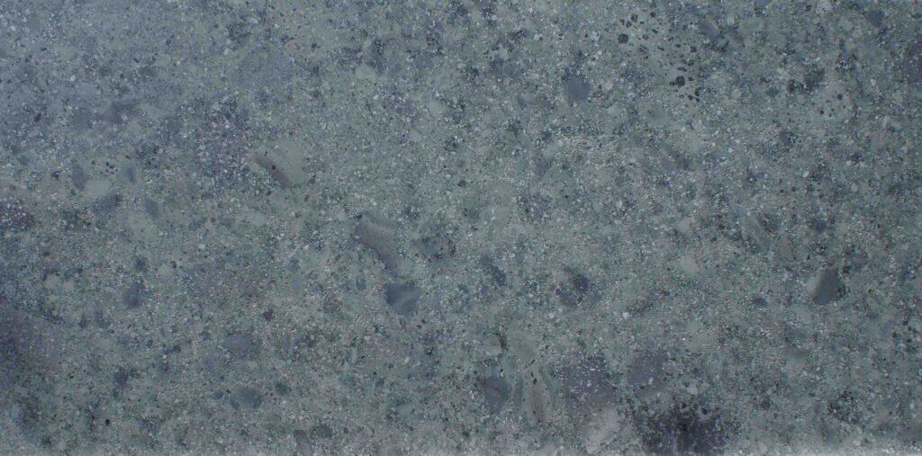 Bali Green Stone natural texture showing authentic volcanic surface with green and grey mineral variations.
