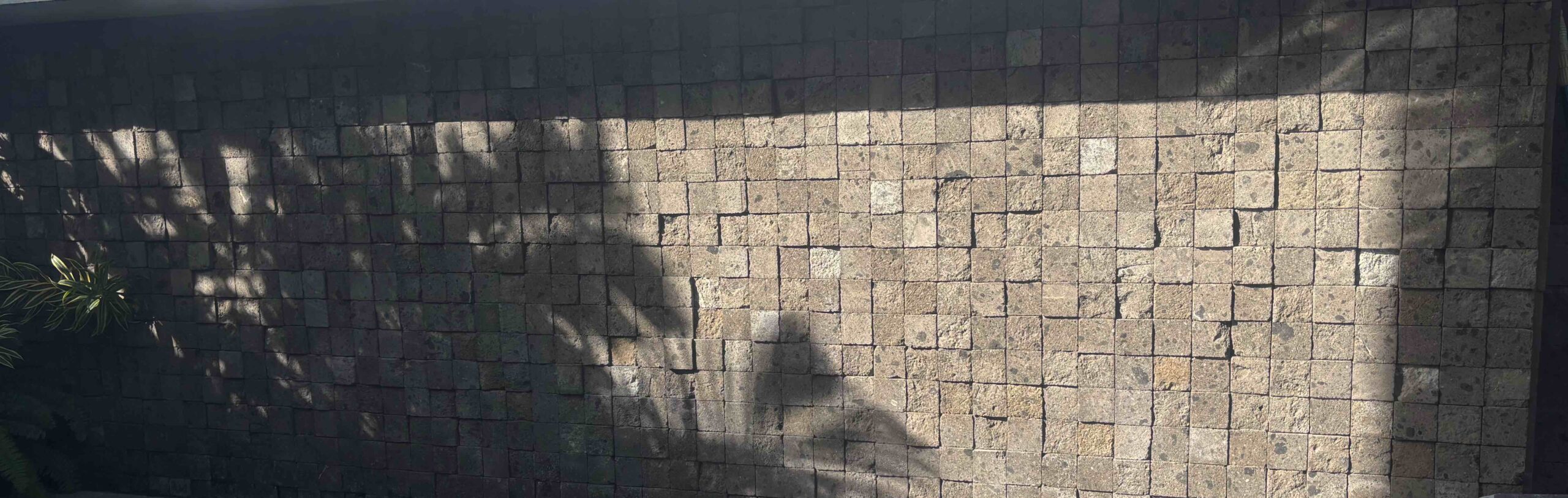 kerobokan stone wall cladding in 10x10 cm tiles showcasing natural grey texture bali-stone-balipooltiles.com